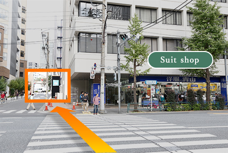 Head straight with the Aoyama suits store on your right