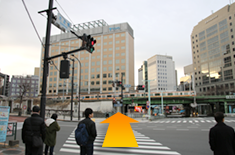 Cross the pedestrian crossing and continue walking forward until you cross Suidobashi bridge.